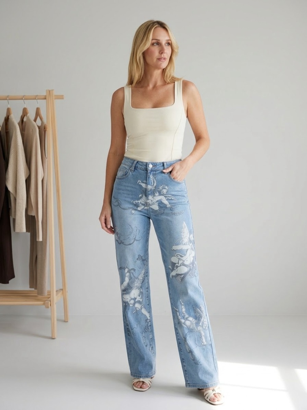 A587. Light Wash Blue Wide-Leg Jeans with White Floral Cherub, Angel Print